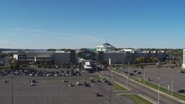 5.7K aerial stock footage fly over parking lot toward the Destiny USA shopping mall, Syracuse, New York Aerial Stock Footage | DX0002_212_023