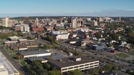 5.7K aerial stock footage descend near office buildings with view of the city's downtown area, Downtown Syracuse, New York Aerial Stock Footage | DX0002_212_034