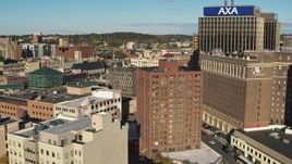 5.7K aerial stock footage flyby office buildings and reveal hotel, Downtown Syracuse, New York Aerial Stock Footage | DX0002_213_020