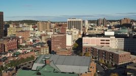 5.7K aerial stock footage of descending past office buildings, Downtown Syracuse, New York Aerial Stock Footage | DX0002_213_023