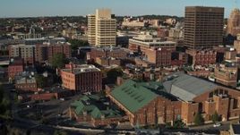 5.7K aerial stock footage orbit Museum of Science & Technology, office buildings in background, Downtown Syracuse, New York Aerial Stock Footage | DX0002_213_035