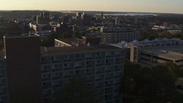 5.7K aerial stock footage ascending by Dellplain Hall at Syracuse University at sunset, New York Aerial Stock Footage | DX0002_214_008