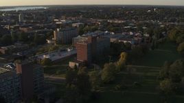 5.7K aerial stock footage of approaching Booth Hall at Syracuse University at sunset, New York Aerial Stock Footage | DX0002_214_011