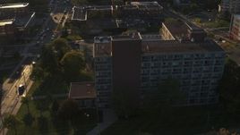 5.7K aerial stock footage of orbiting Booth Hall at Syracuse University at sunset, New York Aerial Stock Footage | DX0002_214_012