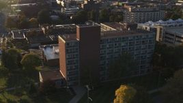 5.7K aerial stock footage of circling Booth Hall at Syracuse University at sunset, New York Aerial Stock Footage | DX0002_214_013