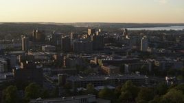 5.7K aerial stock footage of passing by downtown seen from Syracuse University at sunset, New York Aerial Stock Footage | DX0002_214_017