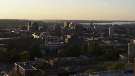 5.7K aerial stock footage of downtown seen from dorm buildings at Syracuse University at sunset, New York Aerial Stock Footage | DX0002_214_018