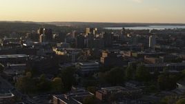 5.7K aerial stock footage focus on downtown, seen from campus buildings at Syracuse University at sunset, New York Aerial Stock Footage | DX0002_214_022
