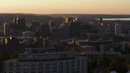 5.7K aerial stock footage of office and city buildings in Downtown Syracuse at sunset, New York Aerial Stock Footage | DX0002_214_027