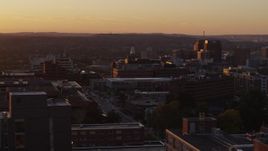 5.7K aerial stock footage a wide orbit of Crouse Hospital in Downtown Syracuse at sunset, New York Aerial Stock Footage | DX0002_214_034