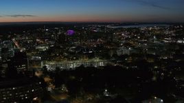 5.7K aerial stock footage of city buildings lit up for the evening in Downtown Syracuse at twilight, New York Aerial Stock Footage | DX0002_215_001