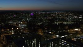 5.7K aerial stock footage city buildings lit up for the evening in Downtown Syracuse at twilight, New York Aerial Stock Footage | DX0002_215_004