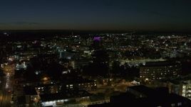 5.7K aerial stock footage descend by Syracuse University at twilight while focused on Downtown Syracuse, New York Aerial Stock Footage | DX0002_215_021