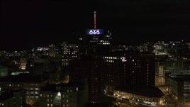 5.7K aerial stock footage of orbiting an office tower and hotel at night, Downtown Syracuse, New York Aerial Stock Footage | DX0002_215_032