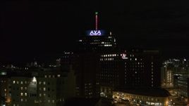 5.7K aerial stock footage orbit office tower and hotel at night, reveal apartment complex, Downtown Syracuse, New York Aerial Stock Footage | DX0002_215_033
