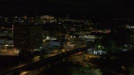 5.7K aerial stock footage of orbiting railroad tracks at night, Downtown Syracuse, New York Aerial Stock Footage | DX0002_215_036