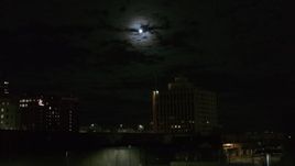5.7K aerial stock footage of the moon above the 500 Building at night, Downtown Syracuse, New York Aerial Stock Footage | DX0002_215_041