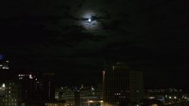 5.7K aerial stock footage of the moon above the 500 Building at night, reveal apartment building, Downtown Syracuse, New York Aerial Stock Footage | DX0002_215_042