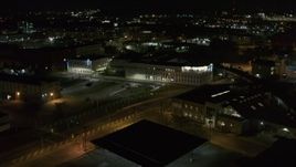 5.7K aerial stock footage of approaching an office building at night, Downtown Syracuse, New York Aerial Stock Footage | DX0002_215_044