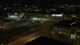 5.7K aerial stock footage descend while focused on an office building at night, Downtown Syracuse, New York Aerial Stock Footage | DX0002_215_045