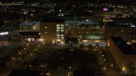 5.7K aerial stock footage of flying toward an office building at night, Downtown Syracuse, New York Aerial Stock Footage | DX0002_215_047