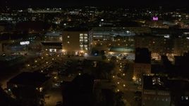 5.7K aerial stock footage of flying away from an office building at night, Downtown Syracuse, New York Aerial Stock Footage | DX0002_215_048