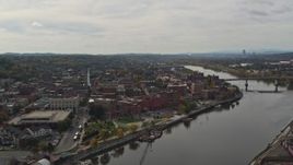 5.7K aerial stock footage of flying away from the downtown area of Troy, New York by the Hudson River Aerial Stock Footage | DX0002_216_006