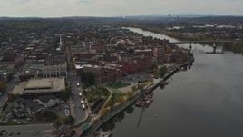5.7K aerial stock footage reverse view of the downtown area of Troy, New York, and riverfront park Aerial Stock Footage | DX0002_216_016
