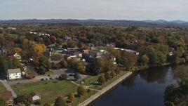 5.7K aerial stock footage of circling buildings and fly away from small town in Fort Edward, New York Aerial Stock Footage | DX0002_216_026