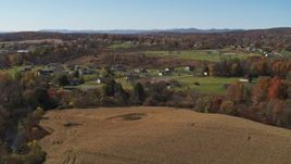 5.7K aerial stock footage of orbiting the small town of Fort Ann, New York, seen from corn fields Aerial Stock Footage | DX0002_216_030