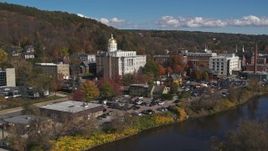 5.7K aerial stock footage of the state capitol building seen while descending by the river, Montpelier, Vermont Aerial Stock Footage | DX0002_218_011
