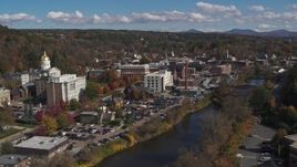5.7K aerial stock footage fly away from government offices and smoke stack by capitol and the river, Montpelier, Vermont Aerial Stock Footage | DX0002_218_020