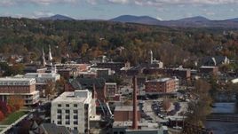 5.7K aerial stock footage of a smoke stack and city buildings by the river, Montpelier, Vermont Aerial Stock Footage | DX0002_218_030