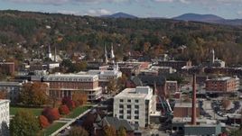 5.7K aerial stock footage of steeples seen from a smoke stack and city buildings, Montpelier, Vermont Aerial Stock Footage | DX0002_218_031