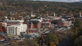 5.7K aerial stock footage of flying by office buildings by a smoke stack, Montpelier, Vermont Aerial Stock Footage | DX0002_218_032