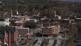 5.7K aerial stock footage of passing office buildings beside the river, Montpelier, Vermont Aerial Stock Footage | DX0002_218_045