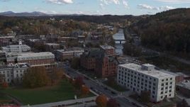 5.7K aerial stock footage descend with view of government and brick office buildings near the river in Montpelier, Vermont Aerial Stock Footage | DX0002_219_013