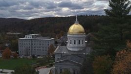 5.7K aerial stock footage focus on the capitol while flying behind trees, Montpelier, Vermont Aerial Stock Footage | DX0002_219_017