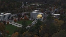 5.7K aerial stock footage reverse view of the capitol while flying above trees, Montpelier, Vermont Aerial Stock Footage | DX0002_219_018