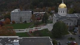 5.7K aerial stock footage of flying away from people walking up the front steps of the capitol building, Montpelier, Vermont Aerial Stock Footage | DX0002_219_028