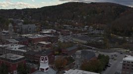5.7K aerial stock footage of flying by city hall and buildings by the river in downtown, Montpelier, Vermont Aerial Stock Footage | DX0002_219_048