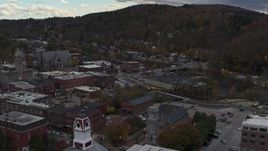 5.7K aerial stock footage of flying by buildings by the river and city hall in downtown, Montpelier, Vermont Aerial Stock Footage | DX0002_219_049