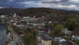 5.7K aerial stock footage of flying away from city hall at sunset, reveal the river, Montpelier, Vermont Aerial Stock Footage | DX0002_220_006