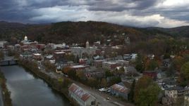5.7K aerial stock footage of a wide orbit of city hall and brick buildings at sunset, approach from river, Montpelier, Vermont Aerial Stock Footage | DX0002_220_011