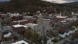 5.7K aerial stock footage of circling city hall and flying away from brick buildings at sunset, Montpelier, Vermont Aerial Stock Footage | DX0002_220_014