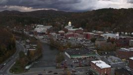 5.7K aerial stock footage of a stationary and reverse view of the state capitol at sunset from the river, Montpelier, Vermont Aerial Stock Footage | DX0002_220_019