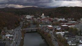 5.7K aerial stock footage of the state capitol at sunset seen from a bridge on the river, Montpelier, Vermont Aerial Stock Footage | DX0002_220_020