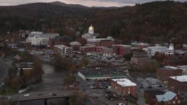 5.7K aerial stock footage ascend and fly away from capitol dome at sunset seen from the river, Montpelier, Vermont Aerial Stock Footage | DX0002_220_025