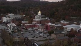 5.7K aerial stock footage circling and fly away from the capitol dome at sunset, Montpelier, Vermont Aerial Stock Footage | DX0002_220_028
