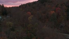 5.7K aerial stock footage of orbiting and flying away from hills with colorful trees at sunset, Montpelier, Vermont Aerial Stock Footage | DX0002_220_043